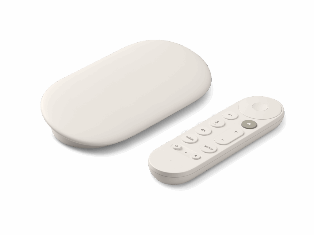 Dispositivo Google TV Streamer de color blanco con forma ovalada y su mando a distancia a juego